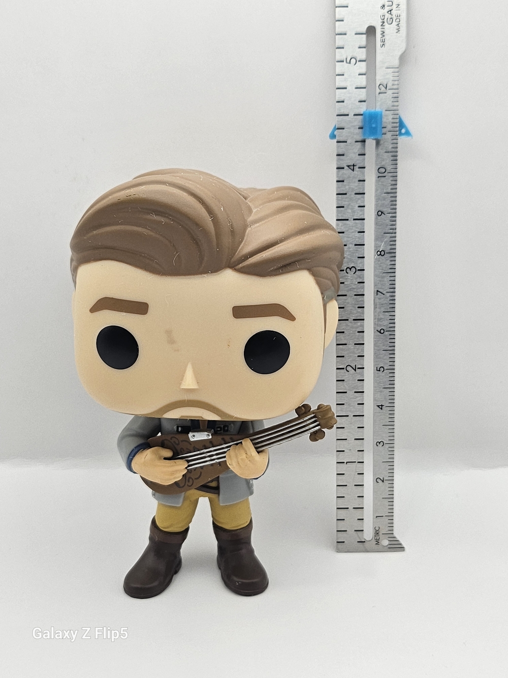 Stylized Vinyl Figure with Brown Hair and Brown Boots